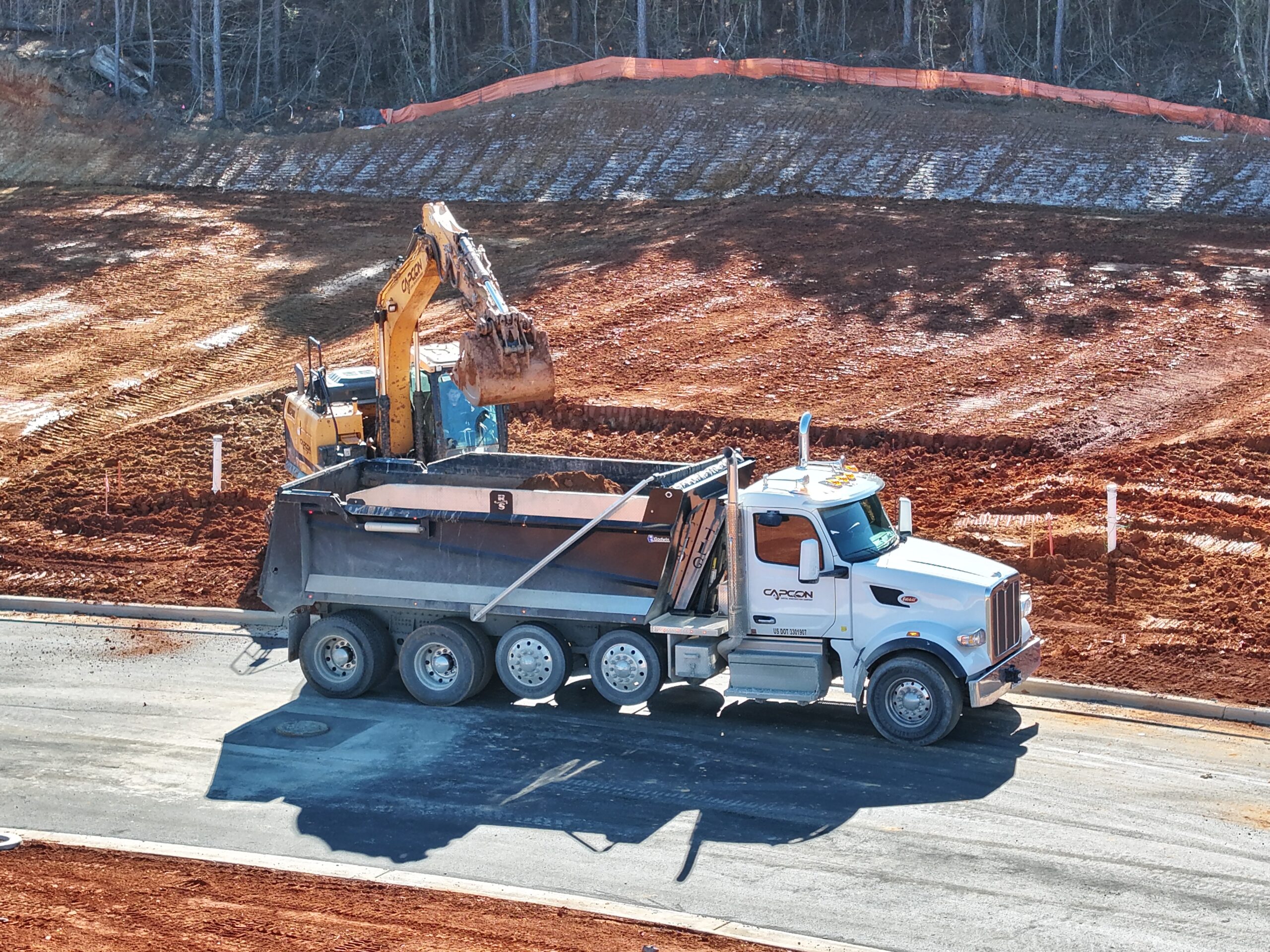 CapCon truck driver and dump truck